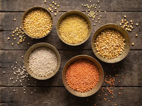 Five brass bowls of split toor, moong, chana, urad and masoor dal